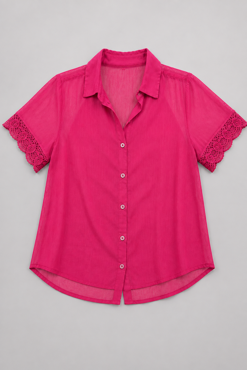 A bright pink short-sleeve button-up shirt with delicate lace trim on the sleeves, laid flat against a neutral gray background.