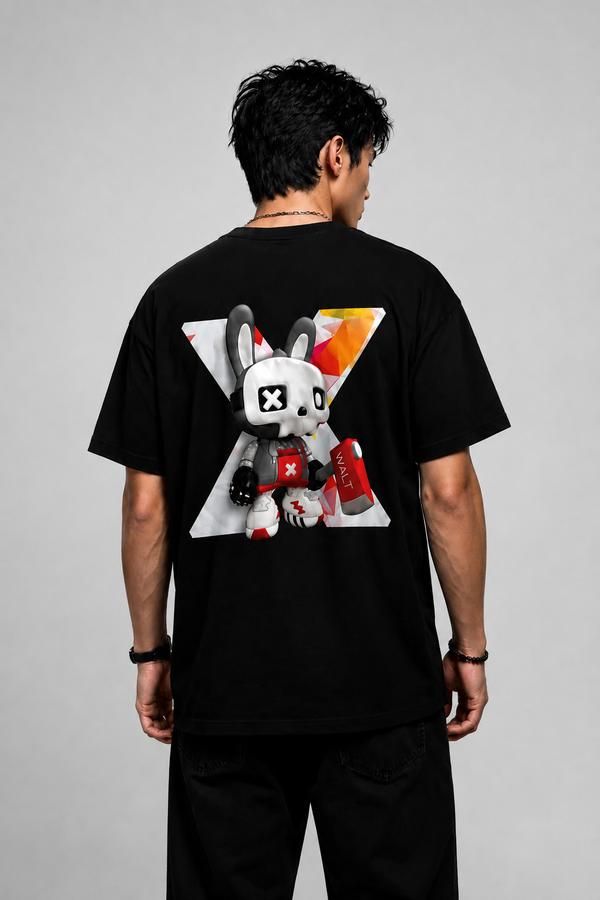 A man viewed from behind wearing a black t-shirt with a large graphic print of a cartoon rabbit character on the back, set against a plain gray studio background.