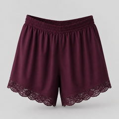 A pair of women's shorts in deep burgundy with a matching elastic waistband and delicate lace trim along the hem, displayed against a neutral light gray background.