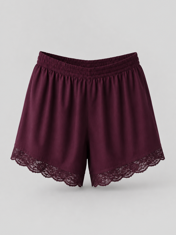 A pair of women's shorts in deep burgundy with a matching elastic waistband and delicate lace trim along the hem, displayed against a neutral light gray background.