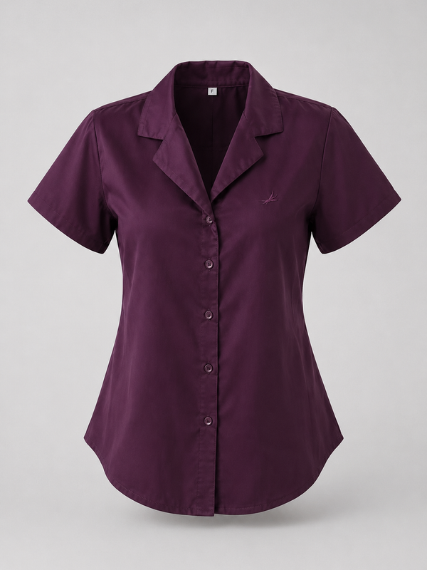 A short-sleeve button-up shirt in deep plum purple, featuring a notched lapel collar and a small embroidered logo on the left chest, displayed on a neutral gray background.
