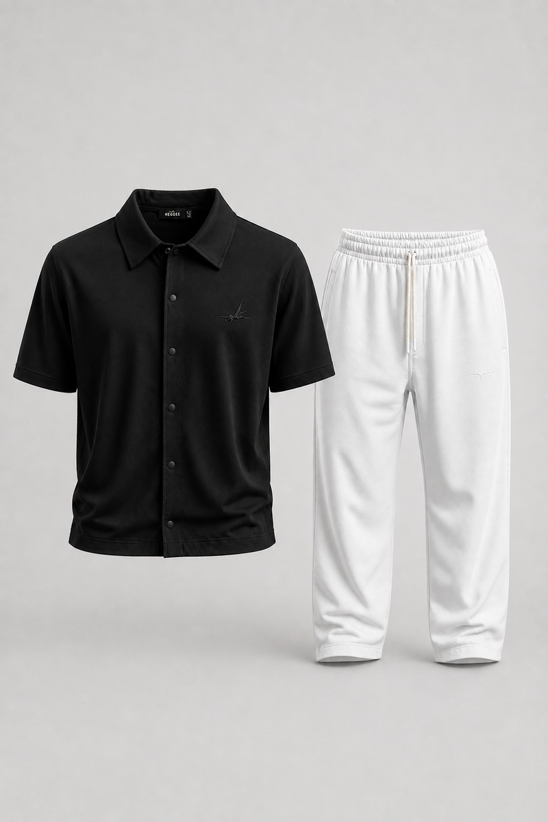 A two-piece clothing set featuring a black short-sleeve button-up shirt and white sweatpants, displayed against a neutral light gray background.