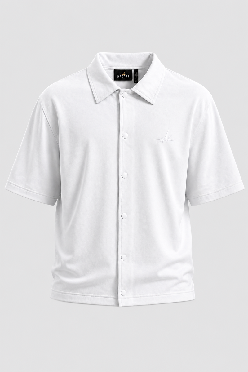 A white short-sleeve shirt with a button-down front, displayed on a neutral light grey background.