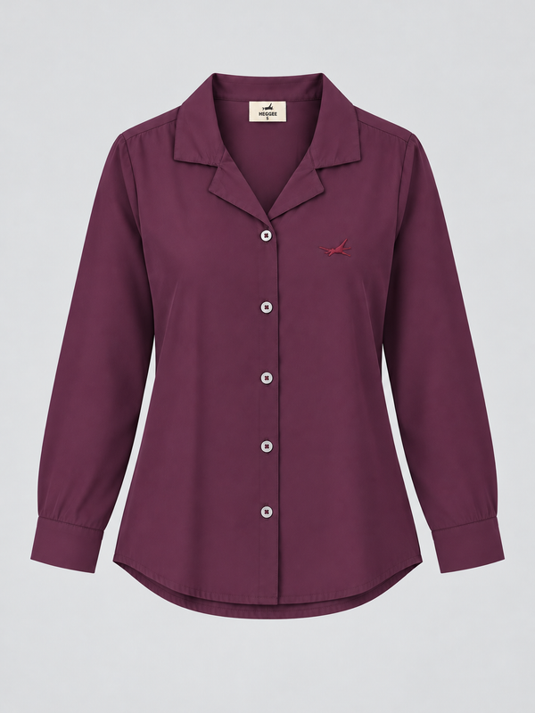 A women's long-sleeve button-up shirt in a deep plum purple color, featuring a pointed collar, white buttons, and a small embroidered red bird logo on the left chest, displayed against a neutral light gray background.