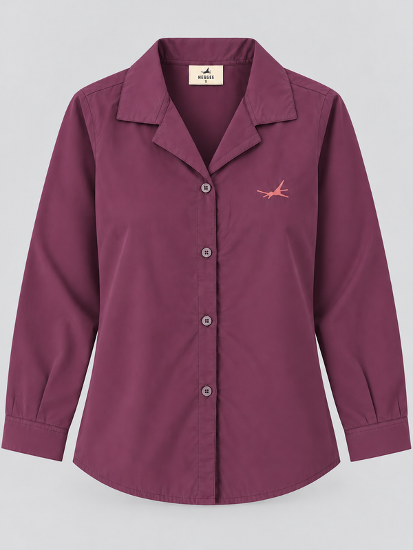 A women's long-sleeve button-up shirt in a  plum purple color, featuring a pointed collar, button front, and a small pink bird logo on the left chest. The shirt is displayed flat against a neutral gray background.