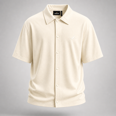 Beige short-sleeve shirt on a gray background