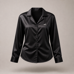 Black satin shirt with a logo on a beige background