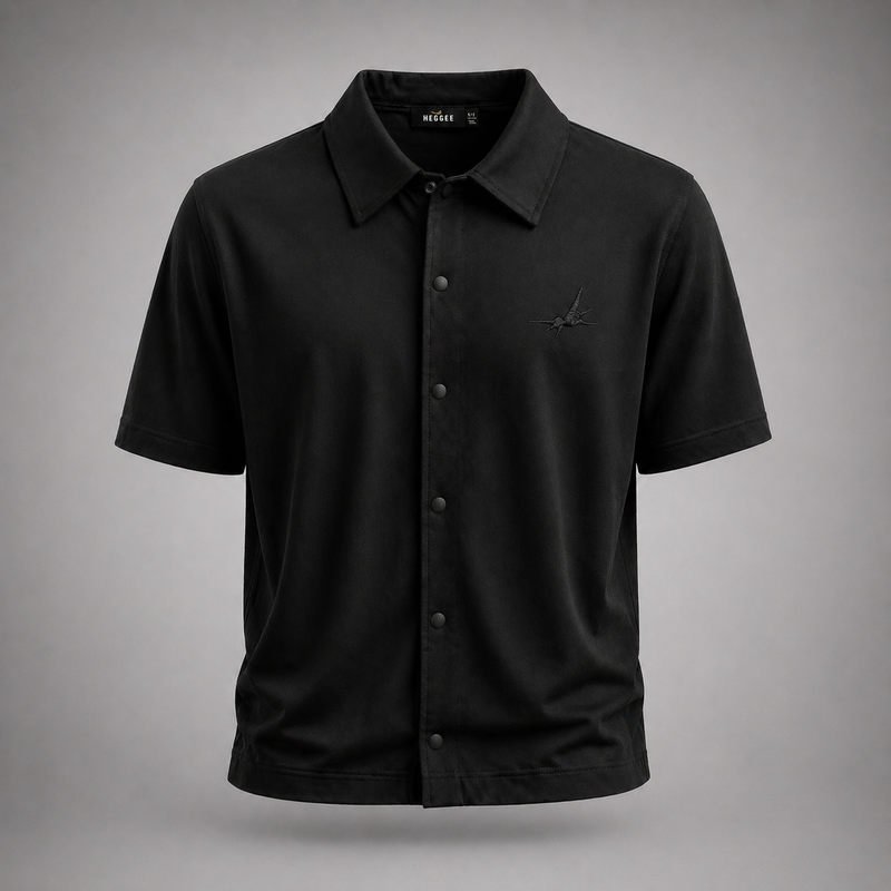 Black short-sleeve shirt with button details on a gray background