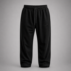 Black pants with a small logo on a gray background