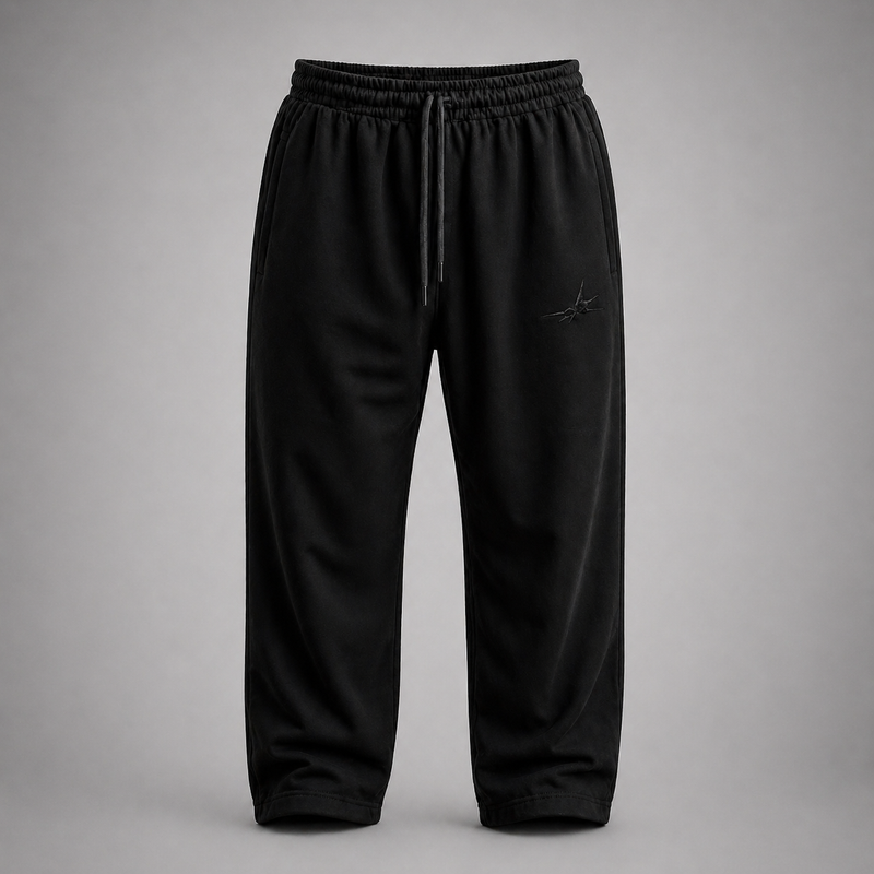 Black pants with a small logo on a gray background