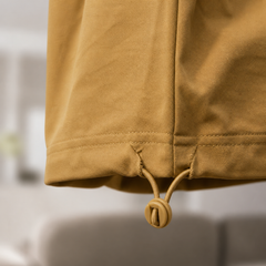 Close-up of a Mustard yellow jacket with a blurred background