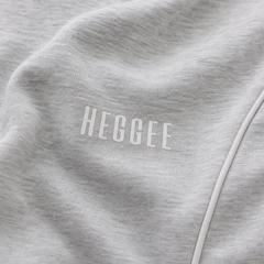 Close-up of a gray fabric with 'HEGGEE' branding.