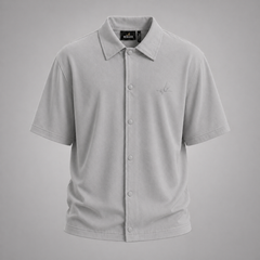 Gray short-sleeve shirt with a brand label on a gray background