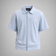 Light blue polo shirt with a brand logo on a gray background