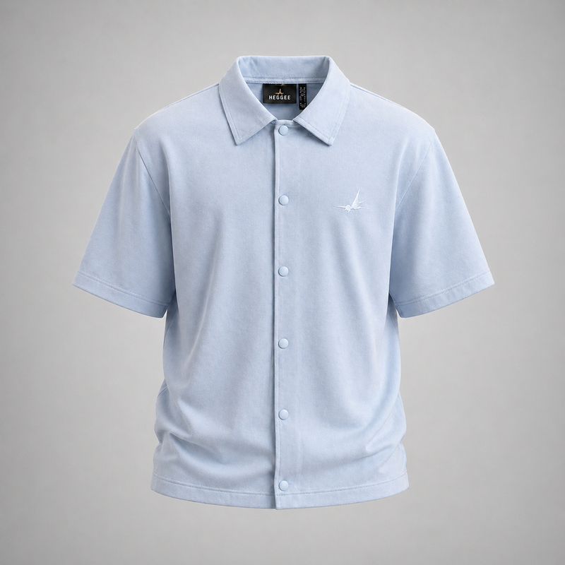 Light blue polo shirt with a brand logo on a gray background