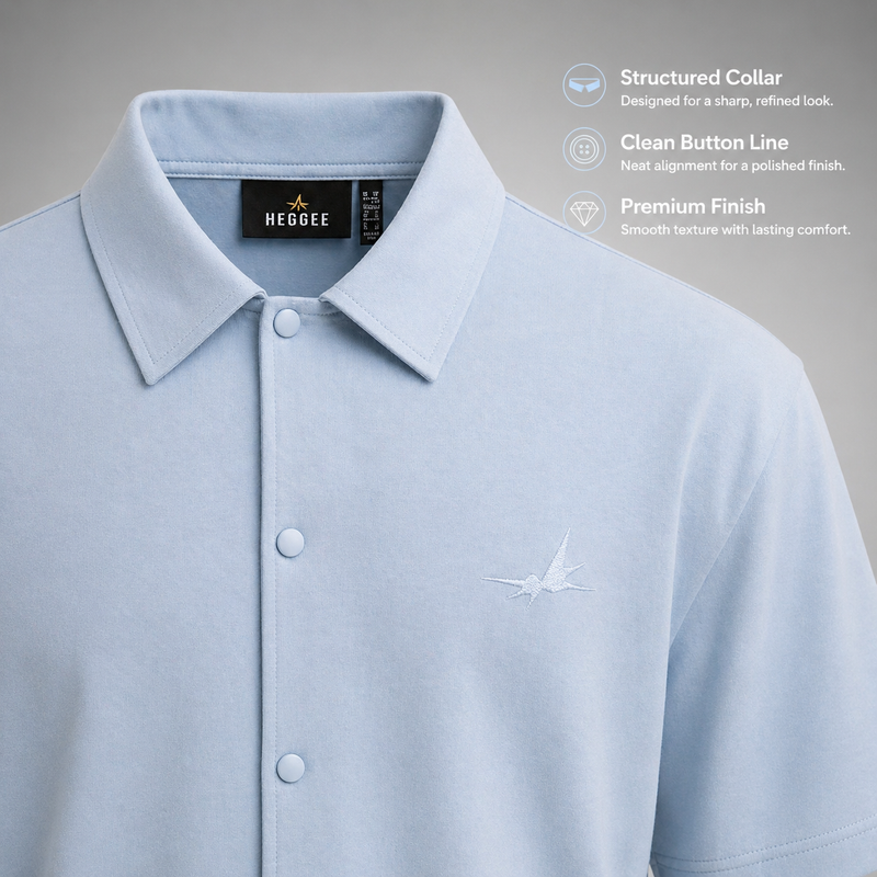 Light blue polo shirt with collar details and HEGGEE branding on a gray background