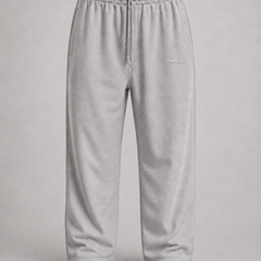 Light gray fleece sweatpants with an elastic waistband and drawstring, shown against a neutral gray background.