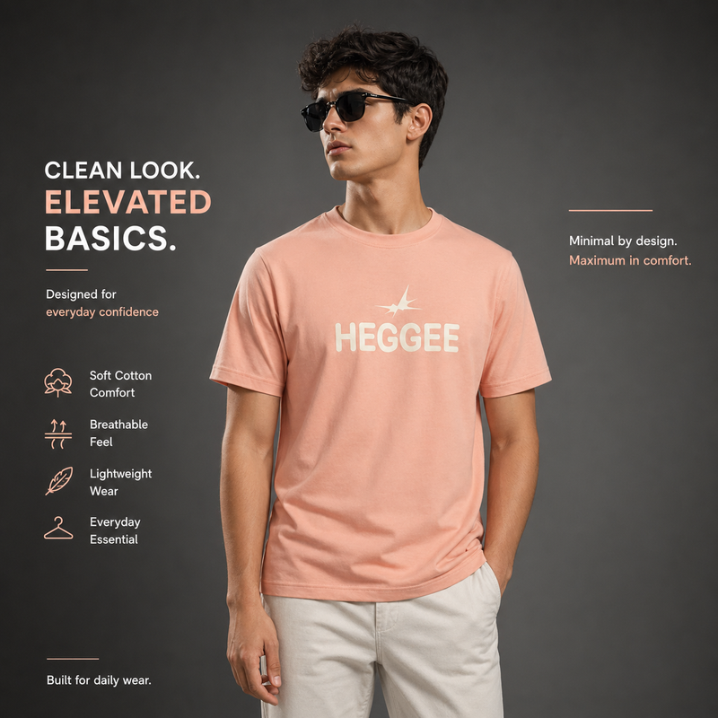 Man wearing a pink t-shirt with 'HEGGEE' branding on a dark background