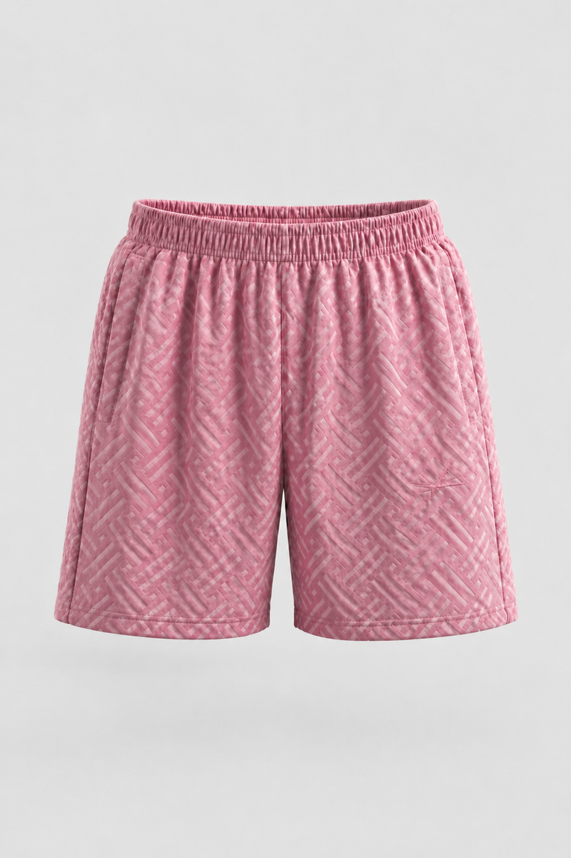 Pink athletic shorts with a textured geometric pattern and an elastic waistband, shown against a light gray background.