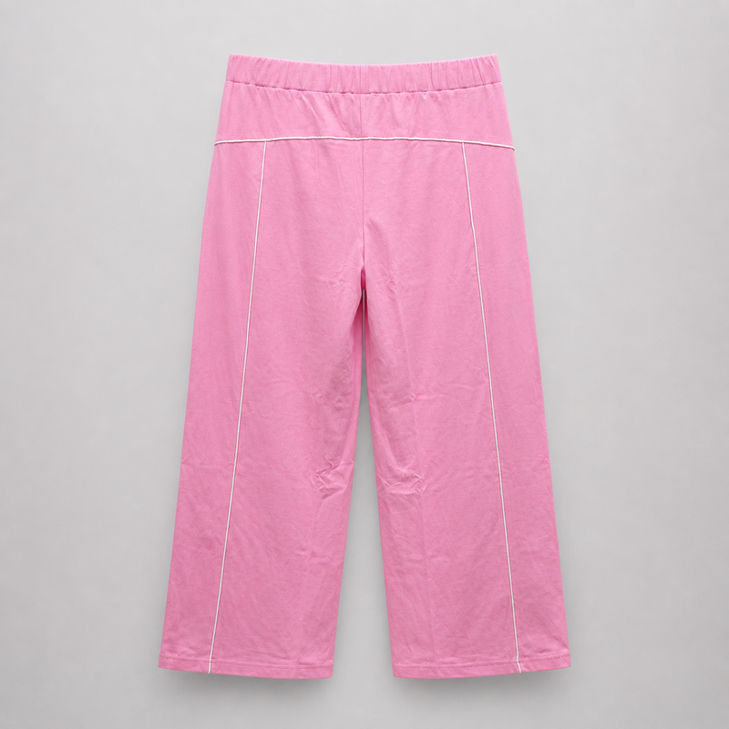 Pink pants with white piping on a gray background