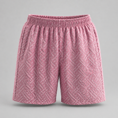 Pink textured shorts on a gray background