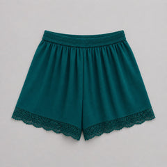 Teal shorts with lace trim on a light gray background