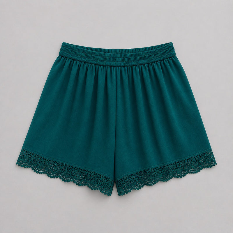 Teal shorts with lace trim on a light gray background